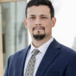 Jacob A. Machitar formal headshot in suit