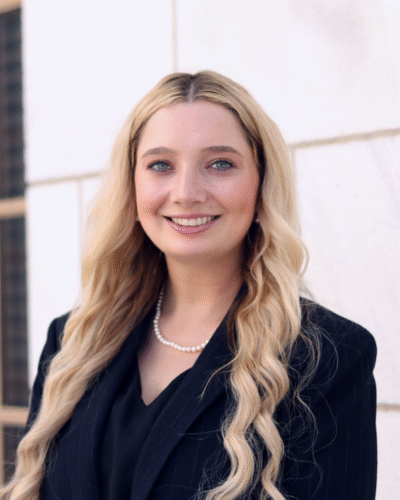 Isabella J. White formal headshot in suit