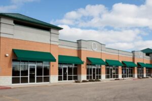 commercial strip shopping mall real estate investment brick building