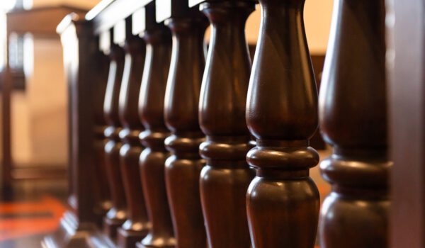 wooden decorative spindles in old courtroom bar
