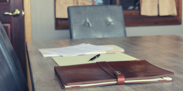 legal law firm conference board room with papers and dossier