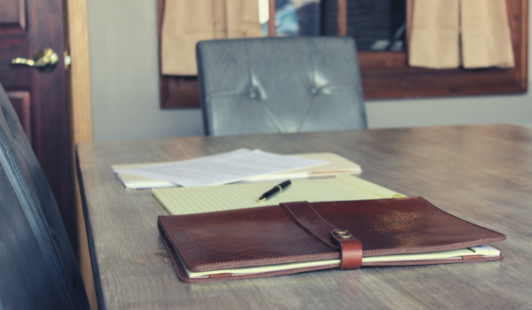 legal law firm conference board room with papers and dossier