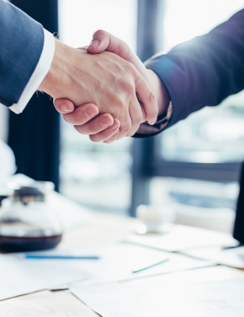 two men in suits shaking hands employment staff careers