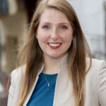 Madison D. Tucker formal headshot in suit