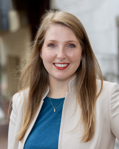 Madison D. Tucker formal headshot in suit