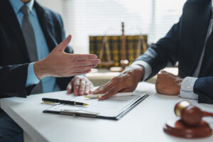 Two lawyers are discussing arbitration details during a meeting in a law office